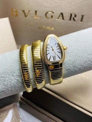 Montre Femme Dorée Serpentine avec Bracelets Assortis